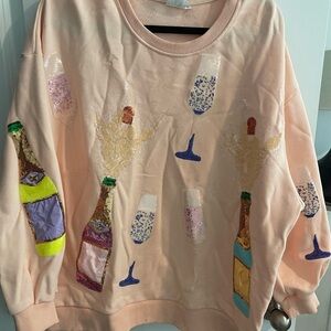 QUEEN OF SPARKLES Festive Bottle and Glass Sweater - Peach